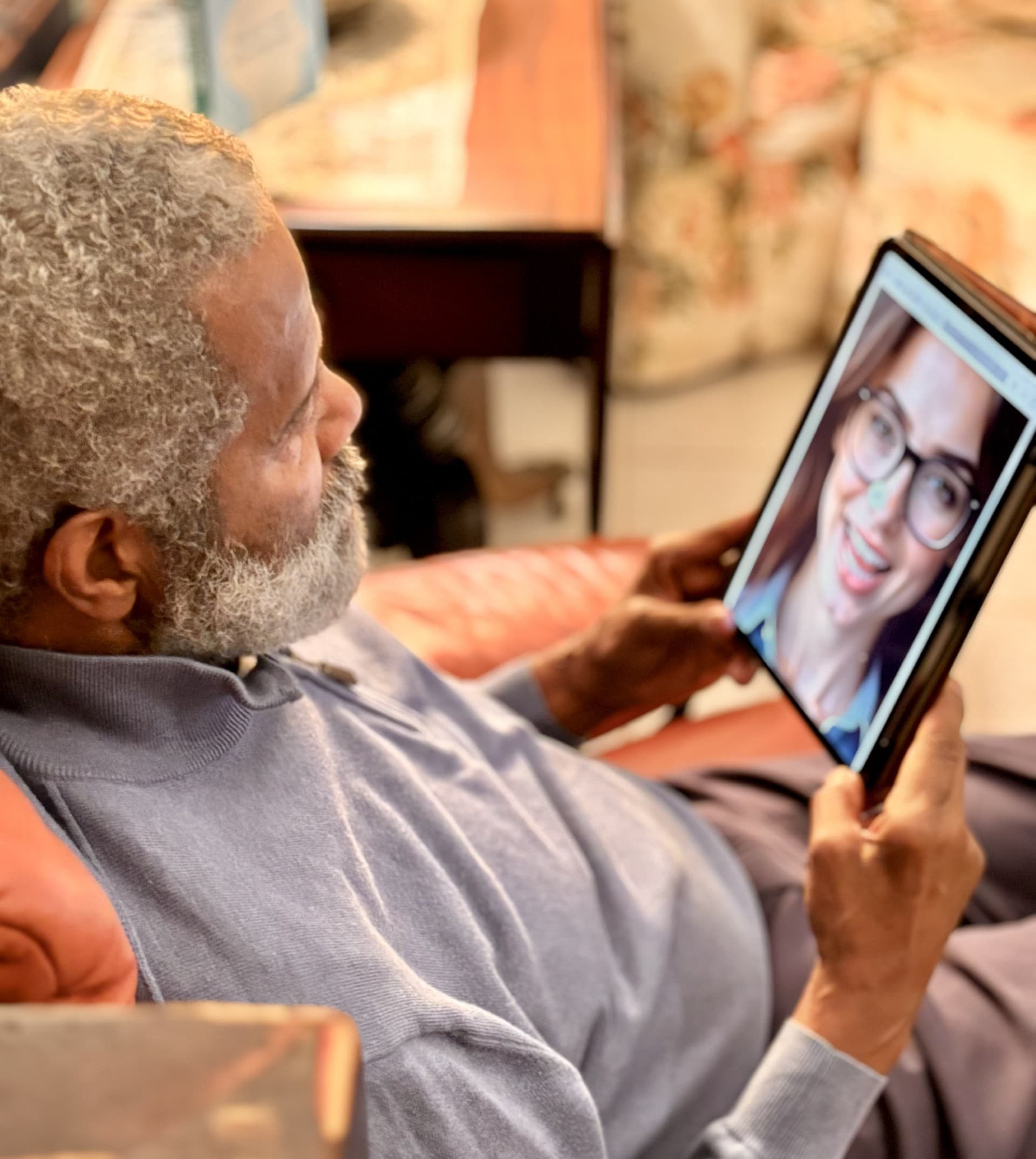 Senior man taking brain health test on tablet